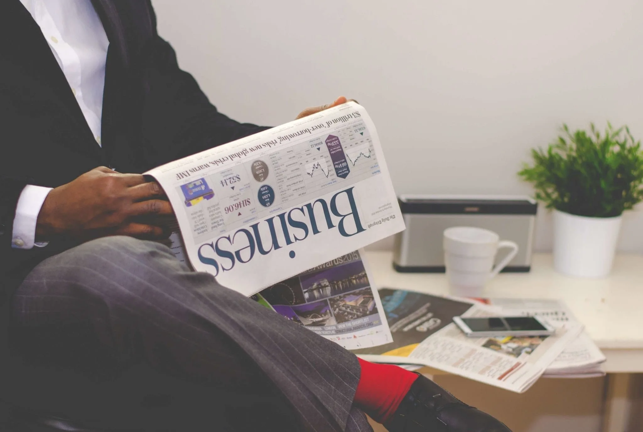 A man reading business news