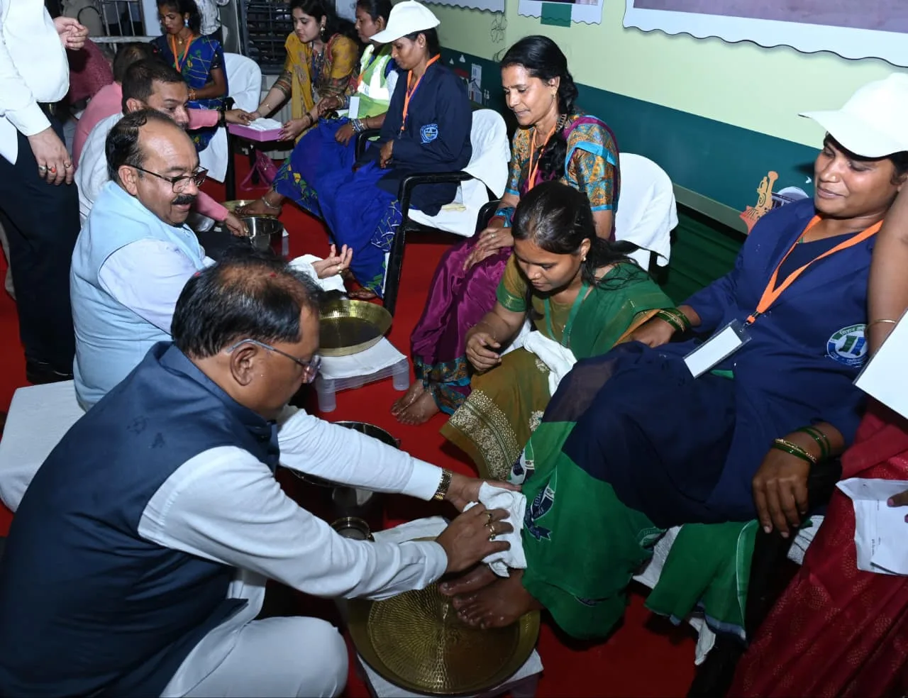 Washing feet CM Sai honoured Swachhta Didis in Chhattisgarh
